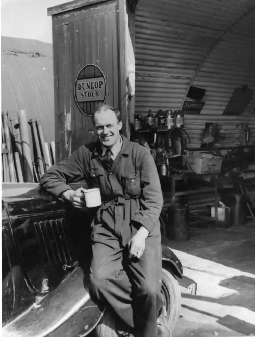 Photo: Don Kennedy taking a break outside the Nissen hut.