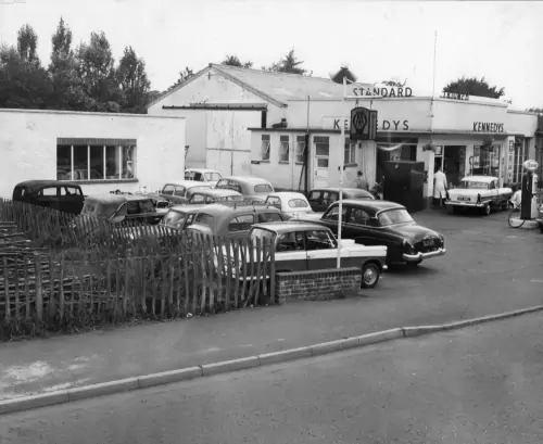 Photo: Kennedy's forecourt & new bodyshop in 1963.