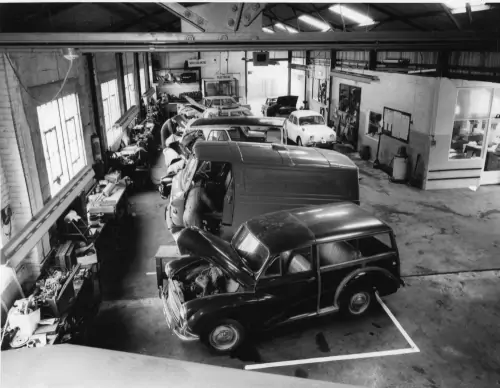 Photo:  Customers' vehicles being worked on in Kennedy's workshop.
