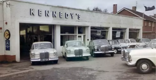Photo: Mercedes cars parked in front of Kennedy's showroom.